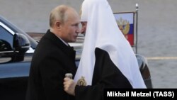 Владимир Путин и предстоятель РПЦ патриарх Кирилл, архивное фото