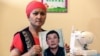 KAZAKHSTAN-CHINA-RIGHTS-XINJIANG-COURT Bikamal Kaken poses with a portrait of her disappeared husband Adilgazy Muqai in a rental apartment in the provincial town of Uzynagash, around 60 kilometres from Kazakhstans largest city Almaty, on August 27, 2020.