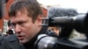 Russia -- Opposition activist Leonid Razvozzhayev gives an interview to journalists outside the Investigative Committee in Moscow, 23Oct2012